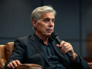 Executive chairman Michael Saylor speaking into a broadcast microphone during a televised interview at a fintech conference.