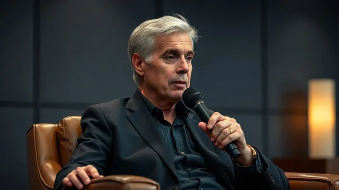 Executive chairman Michael Saylor speaking into a broadcast microphone during a televised interview at a fintech conference.
